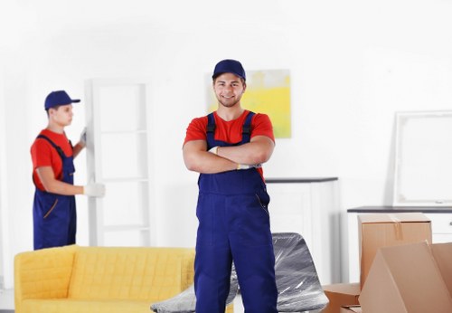 Loading furniture into a van for a Brixton house move