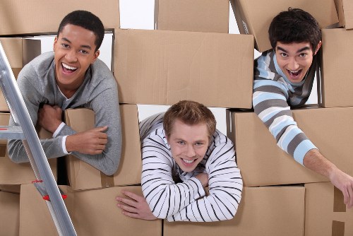 Boxes and furniture being loaded into a van for a Brixton move