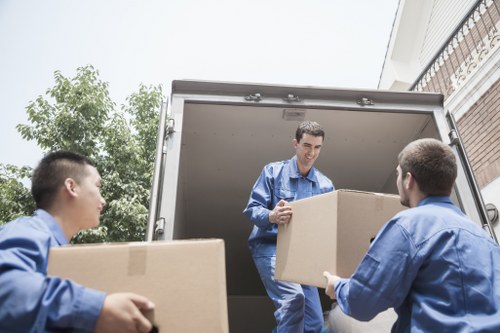 Movers planning an office relocation route near Brixton streets