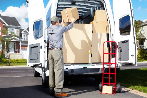 Grand piano being prepared for safe transport by local movers