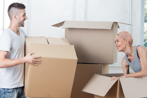 Removal van crew checking secured furniture in transit