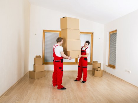 Packed office boxes and furniture ready for local transport in Brixton